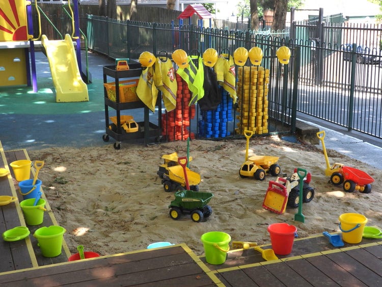 Preschool sandpit, set up with buckets and spades