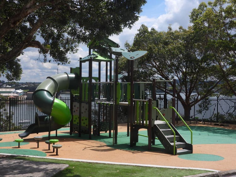 Outdoor play equpment with harbour background.